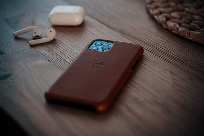 Brown phone case on a wooden table